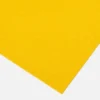An Anti-Slip Flat Sheet in bright yellow is displayed on a plain white background, angled with its bottom right corner pointing downwards.
