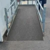 The Anti-Slip Flat Sheet ensures a safe, smooth transition at the end of a wheelchair ramp by eliminating abrupt drops and providing secure, level access to the pavement.