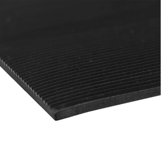 A close-up of Fine Ribbed Rubber Matting, featuring a black textured surface with thin parallel grooves, photographed on a plain white background.